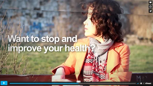 Still from an NHS Smoking Matters film reading “Want to stop and improve your health?” over a woman sitting outdoors.